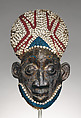 Helmet crest from a nja masquerade, Grassfields artists, Wood, copper, glass beads, raffia palm, cowrie shells, Bamum kingdom